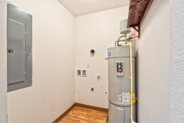 utility room with secured water heater and electric panel