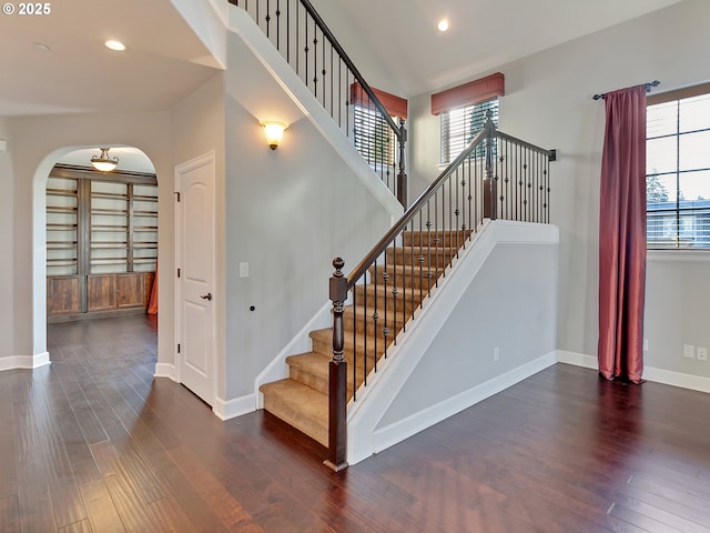 stairs featuring wood-type flooring