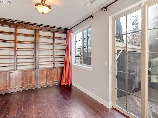 unfurnished room featuring dark hardwood / wood-style flooring