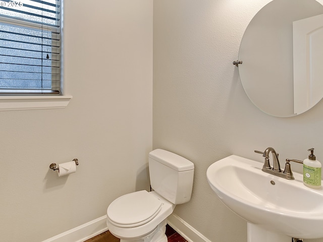 bathroom featuring sink and toilet