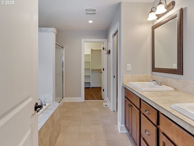 bathroom with vanity, tile patterned floors, and separate shower and tub