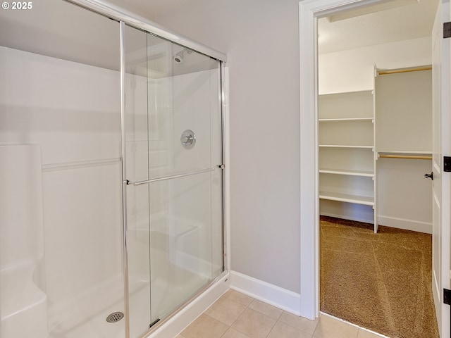 bathroom featuring tile patterned floors and walk in shower