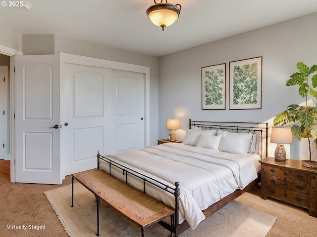 carpeted bedroom with a closet