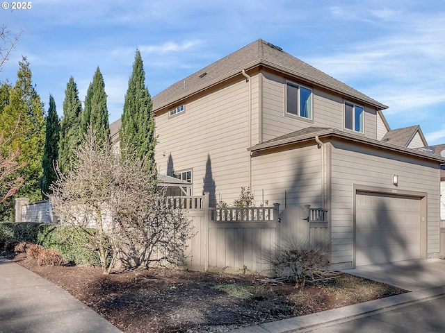 view of property exterior with a garage