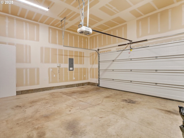 garage with a garage door opener and electric panel