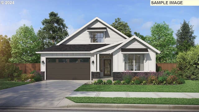 view of front of house featuring a front yard and a garage