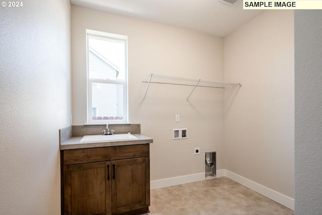 laundry area featuring hookup for an electric dryer, sink, hookup for a washing machine, and light carpet