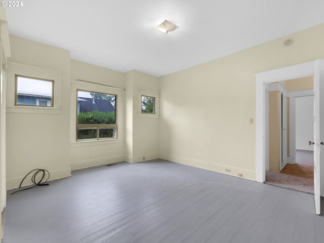 spare room with light hardwood / wood-style floors