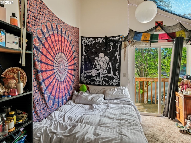 bedroom featuring carpet flooring and access to outside