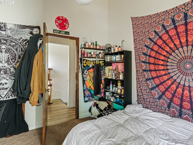 bedroom with hardwood / wood-style floors