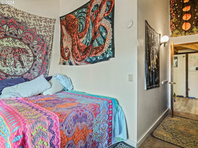 bedroom with wood-type flooring