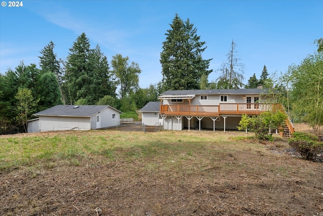 rear view of property with a wooden deck