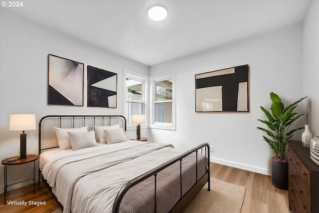 bedroom with light hardwood / wood-style floors