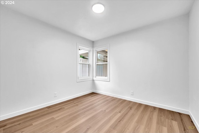 unfurnished room with light hardwood / wood-style floors