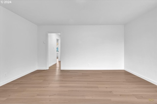 spare room with light hardwood / wood-style flooring