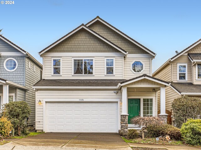 craftsman house with a garage