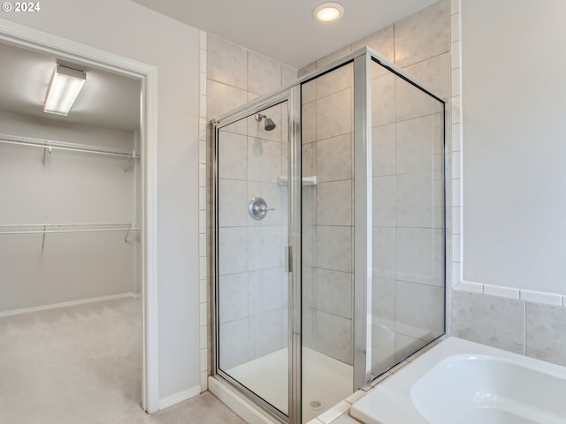 bathroom with separate shower and tub