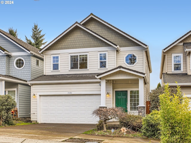 craftsman house with a garage