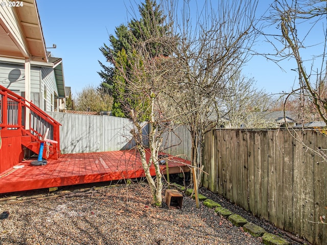 view of yard featuring a wooden deck