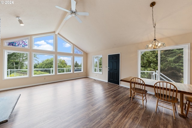 interior space featuring ceiling fan with notable chandelier and lofted ceiling with beams