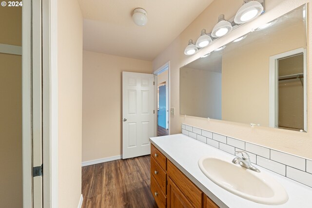 bathroom with vanity and wood-type flooring