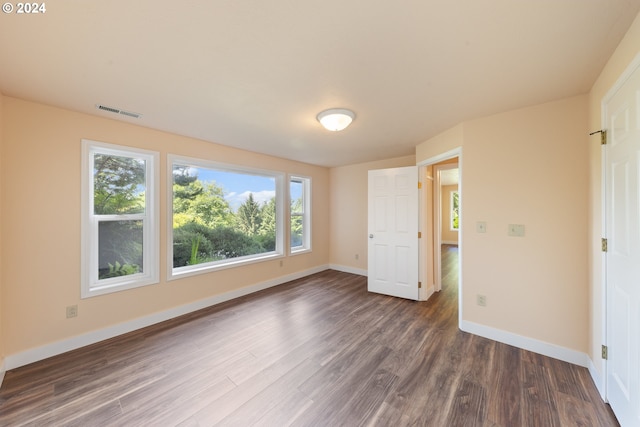 unfurnished bedroom with hardwood / wood-style floors