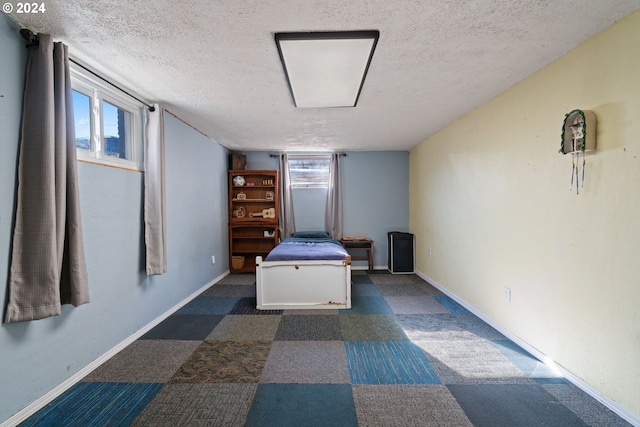 unfurnished bedroom featuring a textured ceiling