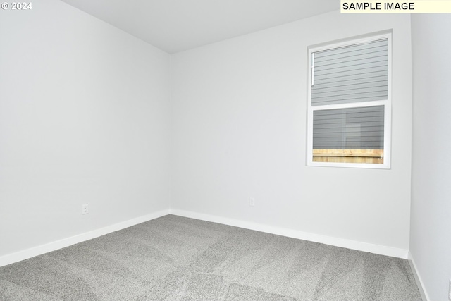 empty room with carpet flooring