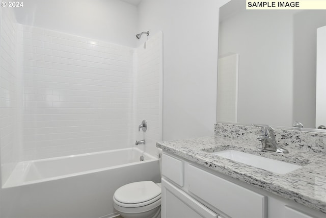 full bathroom with washtub / shower combination, vanity, and toilet