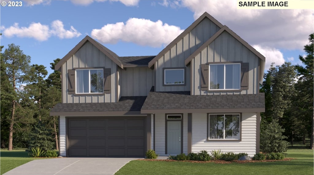 view of front facade featuring a front yard and a garage