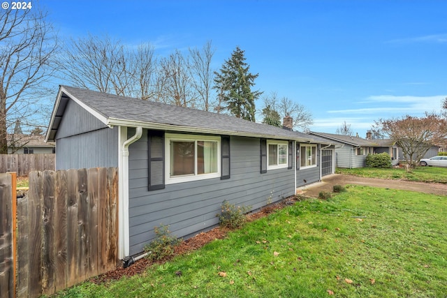4711 Siesta Ct NE, Salem, OR 97305 - view of side of home with a lawn