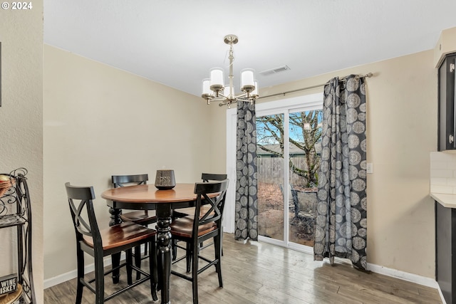 4711 Siesta Ct NE, Salem, OR 97305 - dining area with wood-type flooring and an inviting chandelier