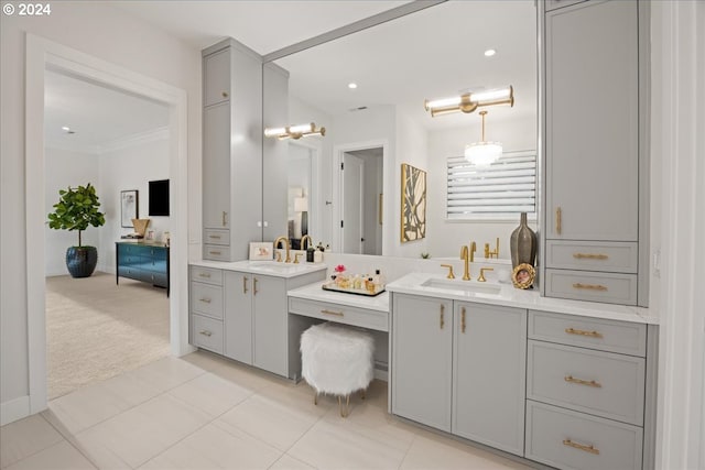 bathroom with vanity, crown molding, and tile patterned floors