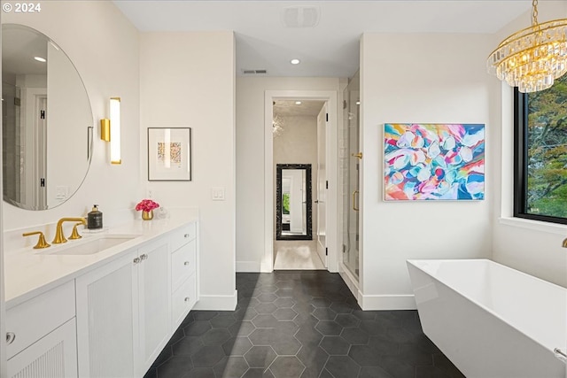 bathroom with vanity, a bathing tub, and tile patterned floors