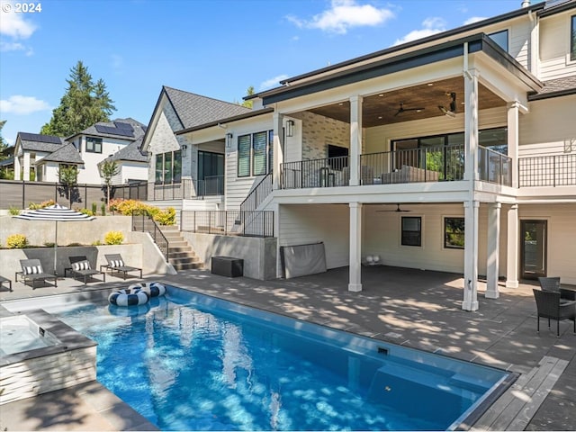 back of house with a patio, ceiling fan, and a fenced in pool