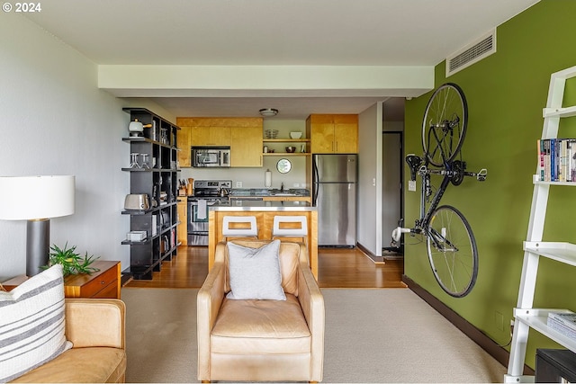 living room with sink and hardwood / wood-style flooring