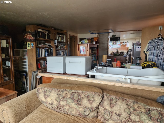 living room with light wood-type flooring, a wall mounted AC, and wooden walls