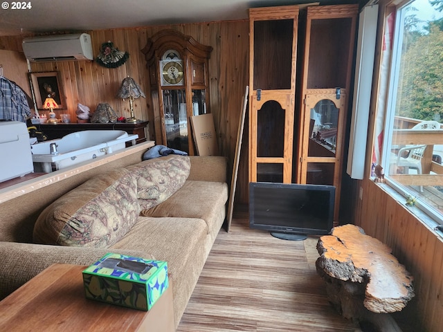 interior space featuring an AC wall unit and hardwood / wood-style floors