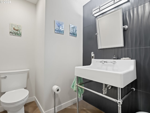 bathroom with tile patterned floors, toilet, and sink