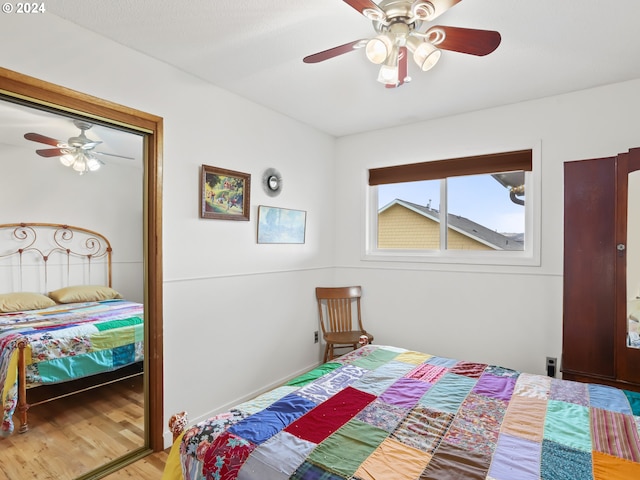 bedroom featuring ceiling fan and hardwood / wood-style floors