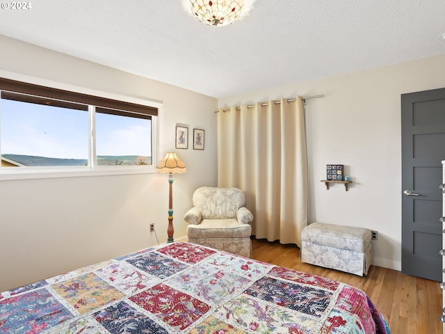 bedroom with light wood-type flooring