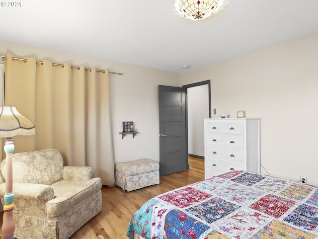 bedroom with wood-type flooring