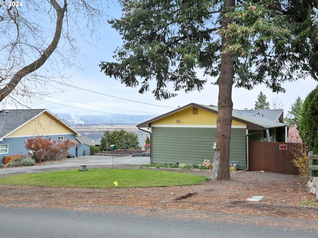 view of side of property featuring a garage