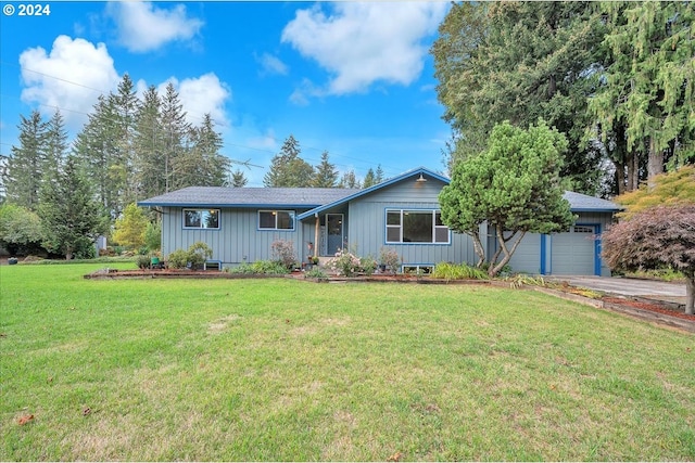 ranch-style home with a front lawn and a garage