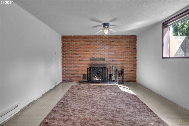 unfurnished living room featuring a textured ceiling, a fireplace, ceiling fan, and carpet flooring