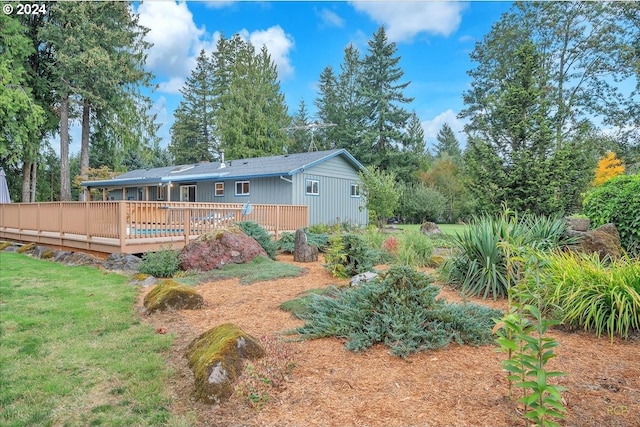 view of yard featuring a wooden deck