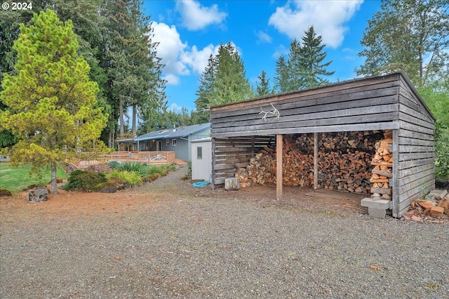 view of outbuilding featuring a carport