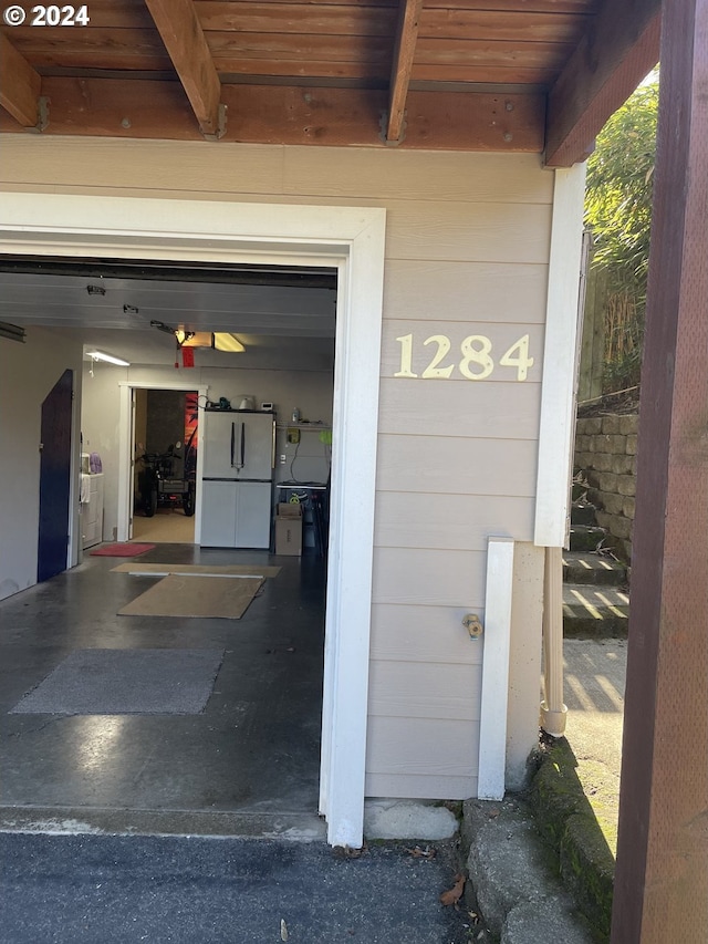 garage with white refrigerator