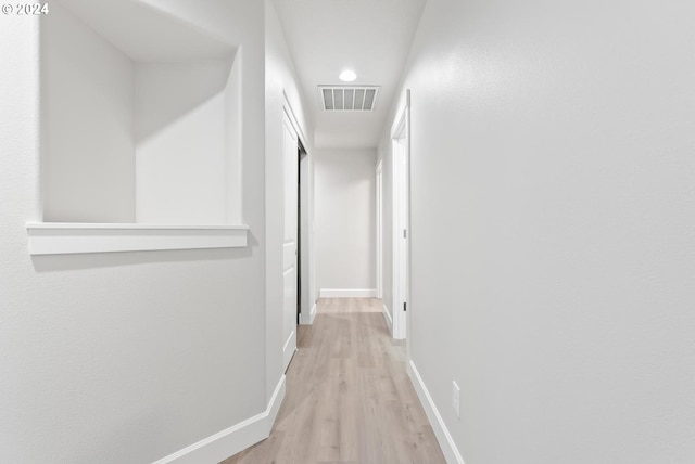 corridor featuring light hardwood / wood-style flooring