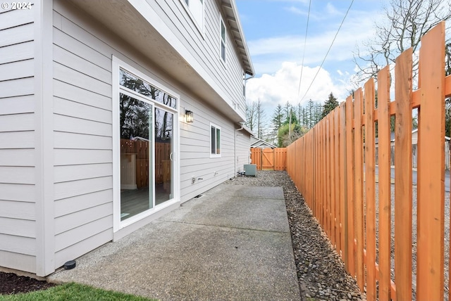 view of side of home featuring a patio